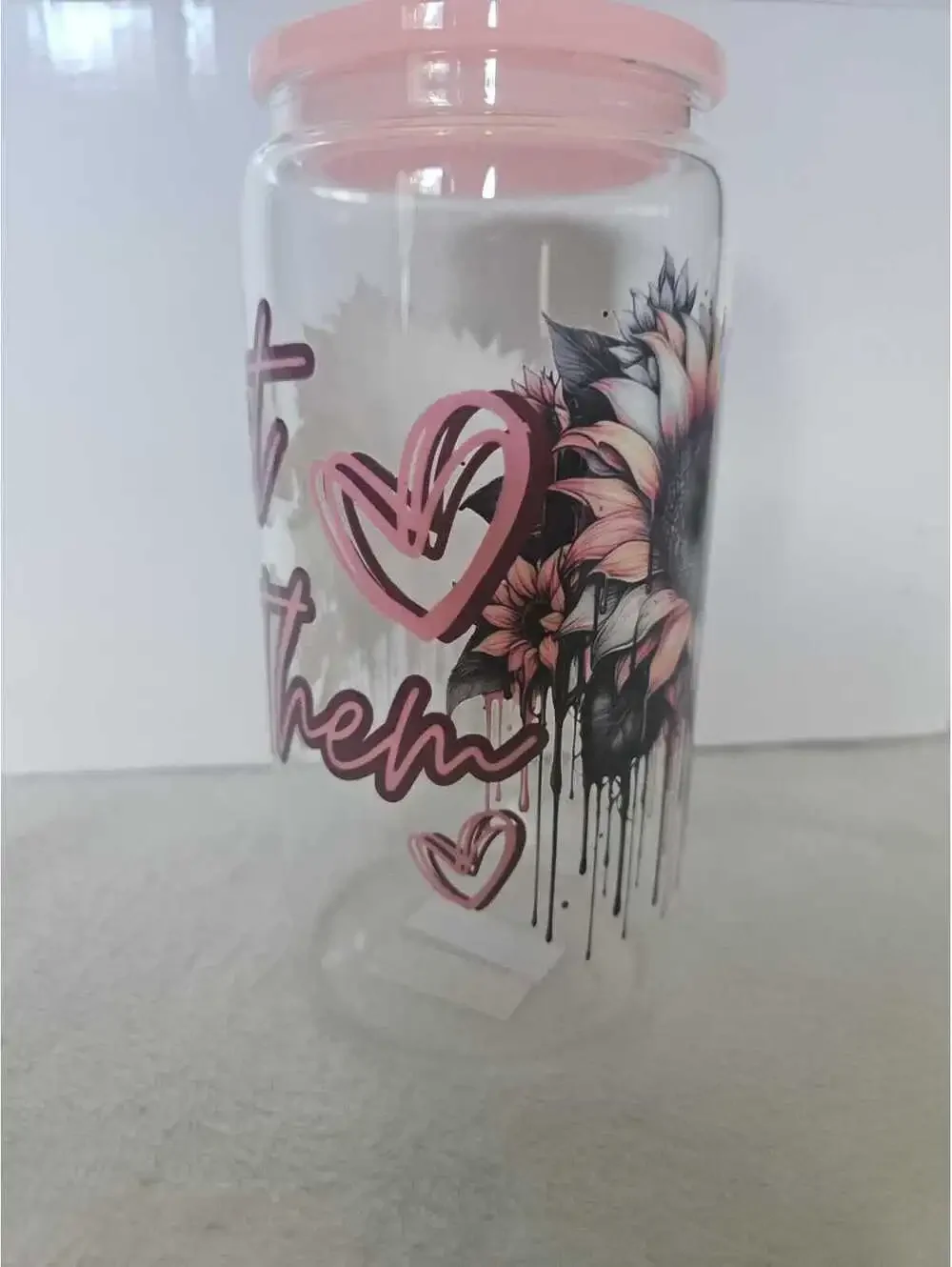16 oz glass cup with acrylic Lid. Comes w/ straw and straw cleaner.